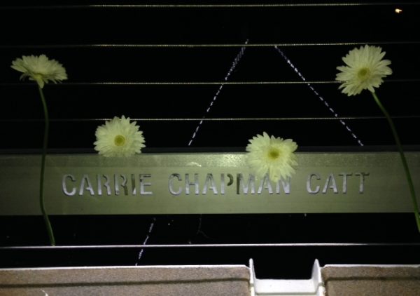 Daisies were handed out during the dedication ceremony. Bystrom and others in support of Catt decorated her nameplate before tossing them into the Des Moines River.