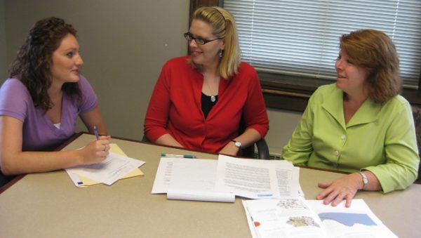 Sawyer Baker and Valerie Hennings, scholar-in-residence at the Catt Center, discuss the Gender Balance Project with Phyllis Peters, secretary of the Friends of the Iowa Commission on the Status of Women.