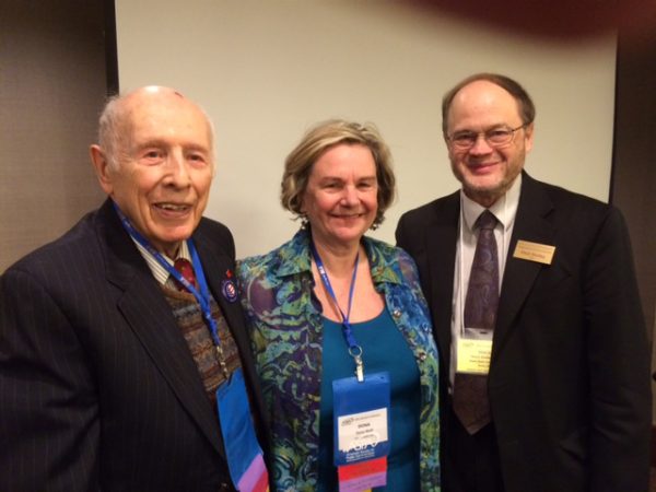 Dwight Ink (left), Dona Wolf and Mack Shelley, chair of the Iowa State department of political science, pose during the ASPA panel.