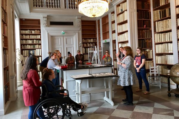 Students viewed a first edition of "The Adventures of Huckleberry Finn" and an original letter from Samuel Clemens during their tour of the Uppsala University Library.