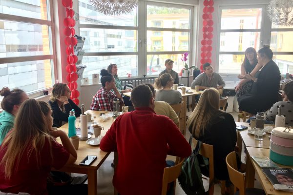 Students enjoy “fika” while meeting with our service partners from Individuell Människohjälp, an organization that assists refugees in Sweden.