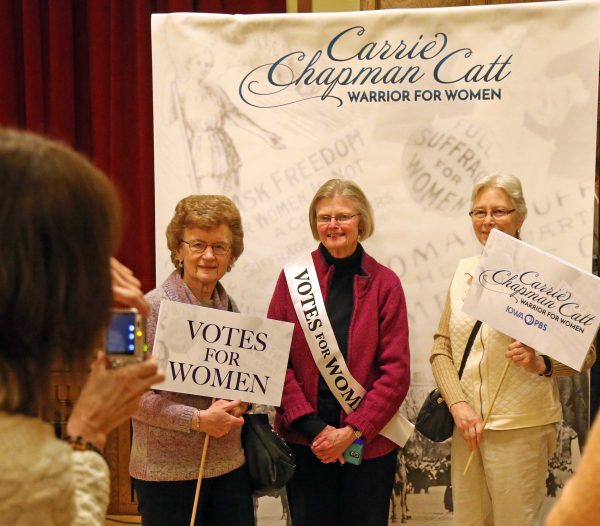 Attendees get their picture taken before the screening of the Iowa PBS documentary "Carrie Chapman Catt: Woman Warrior."